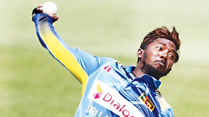 Dananjaya get year-long suspension for illegal bowling action