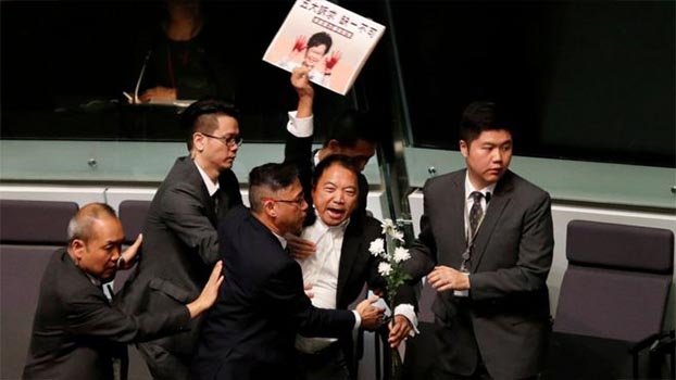 Pro-democracy MPs dragged out of HK legislature