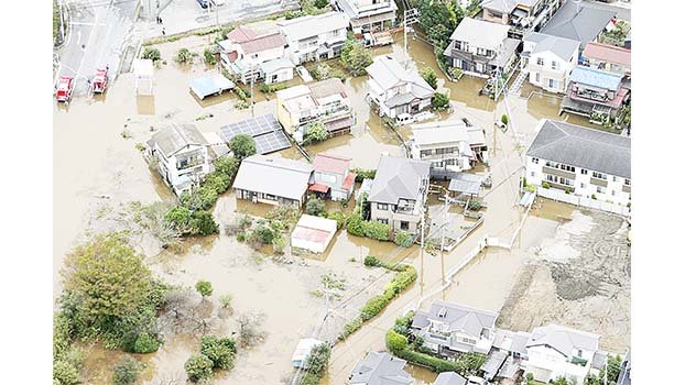 Landslides, floods kill 10 in Japan