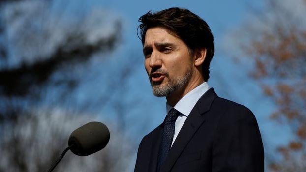 Canada’s Trudeau warns virus restrictions could last weeks, months