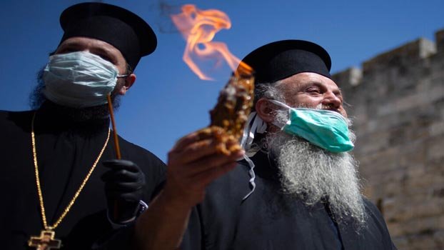 Empty Jerusalem church holds ‘Holy Fire’ ceremony