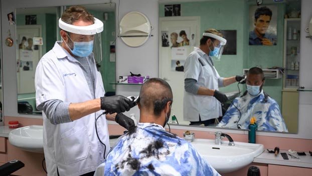 Virus lockdowns begin to ease,  cases top three million