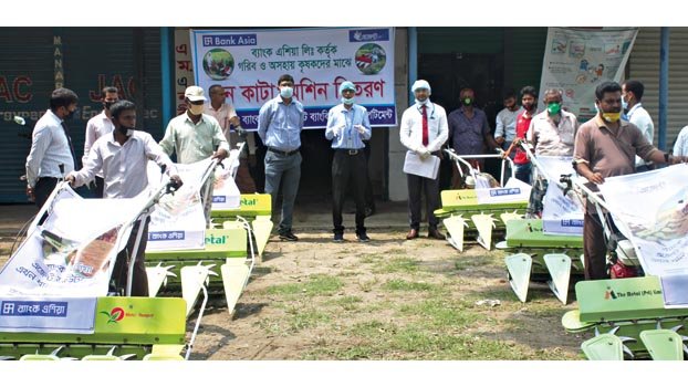 Bank Asia provides free reaper machine for farmers