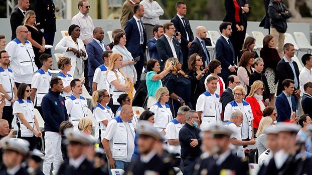 France celebrates health care workers  and grants them $9bn in pay rise