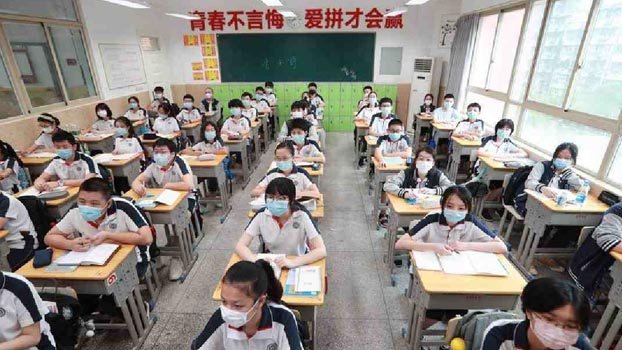 Chinese students begin full return  to school