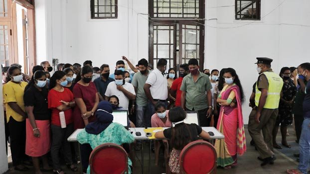 Sri Lanka closes key offices as virus outbreak surges