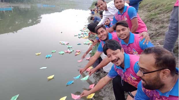 People float paper boats in  Chitra protesting pollution