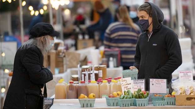 Americans urged to stay home for Thanksgiving as virus surges