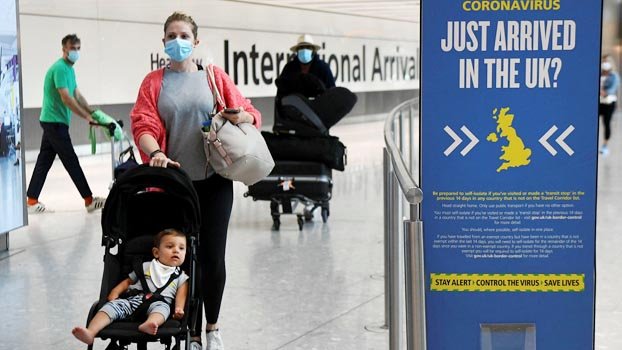 UK to reduce virus quarantine for  travellers