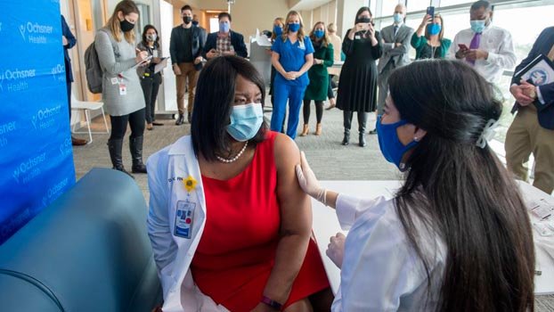Healing is coming: US health workers start getting vaccine