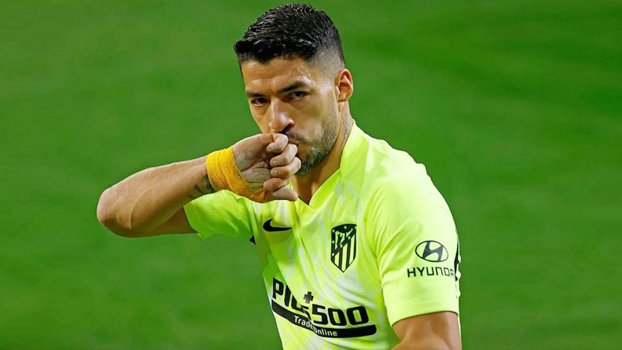 Suarez double fires Atletico seven points clear