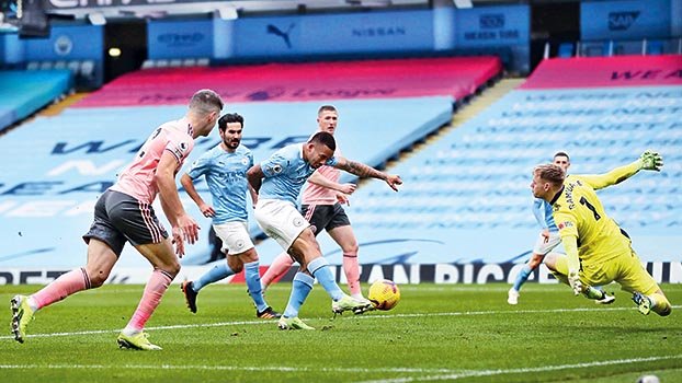 Manchester City move clear at the top