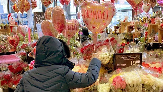 A bleak Valentine’s Day, lovers find hope in roses, vaccines