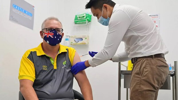 Australia administers first Covid-19 vaccines