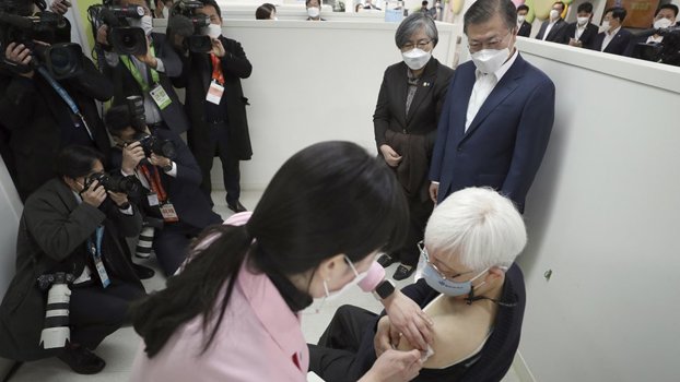 First vaccines reach arms  in S Korea, Hong Kong