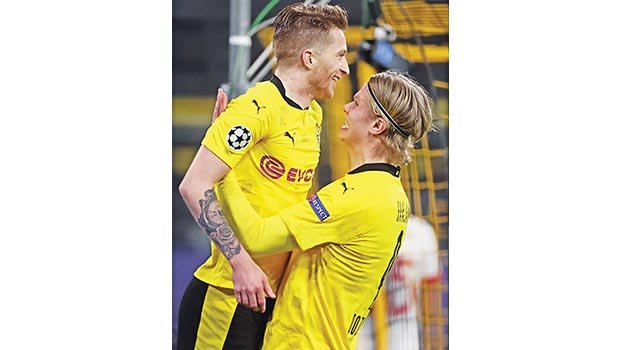Haaland goals send Dortmund past Sevilla