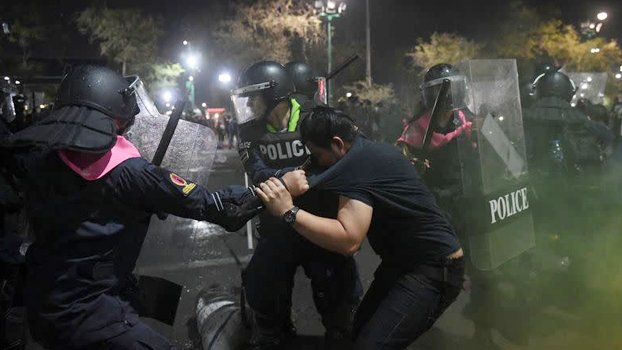 Thai police shoot water cannon at protesters near king’s palace