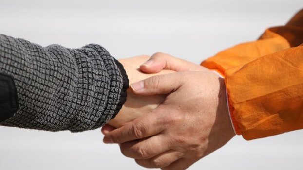 COVID-19: Shaking hands in a shaken World
