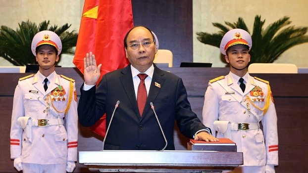 Vietnam’s pandemic response leader sworn in as president