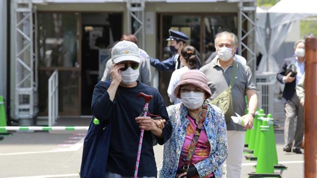 Japan opens mass vaccination centers 2 months before Games