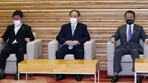 Japan to extend virus emergency with safe Olympics at stake