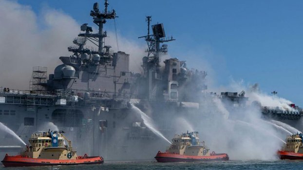 US Navy charges sailor with arson in fire that destroyed warship