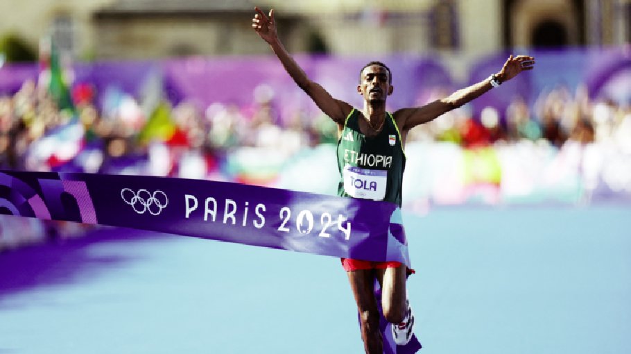 Tola wins marathon gold