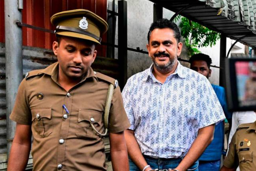 S Lanka detains ex-minister Rajapaksa over corruption