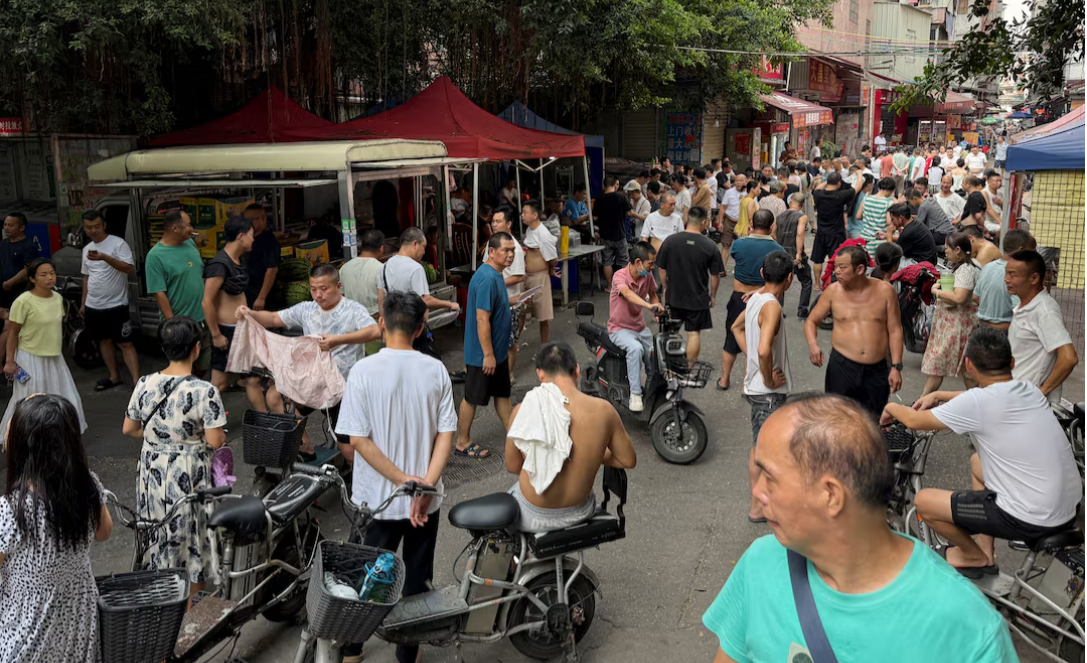 China factories cut shifts and workers' pay as US tariffs bite