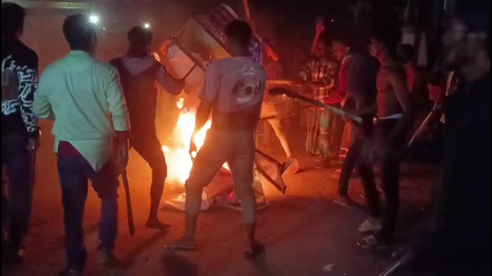 Torch rally leads to violence, cocktail blasts