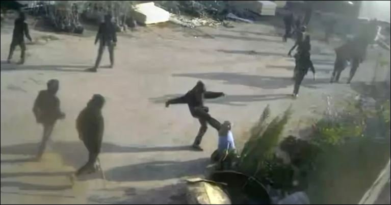 Video shows armed men beating a Palestinian in Israeli-occupied West Bank