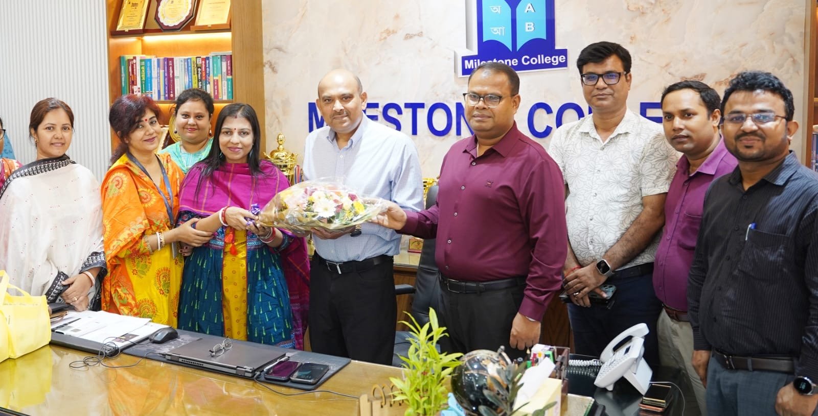 Principal of Milestone College exchanges greetings with Hindu teachers on the occasion of Sharadiya Durgotsav